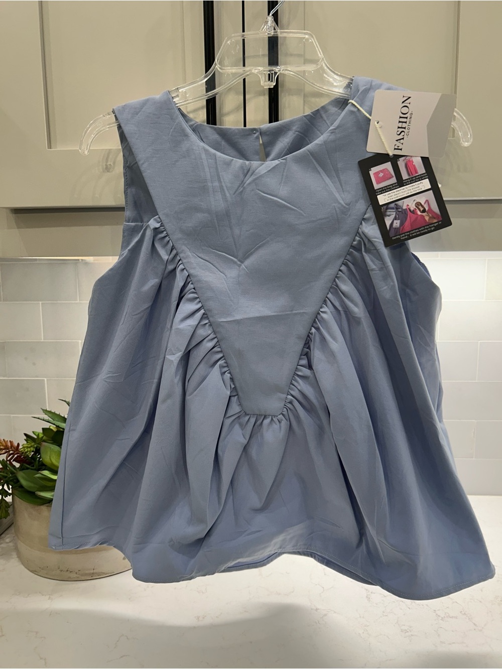 Light Blue Sleeveless Ruffled Top